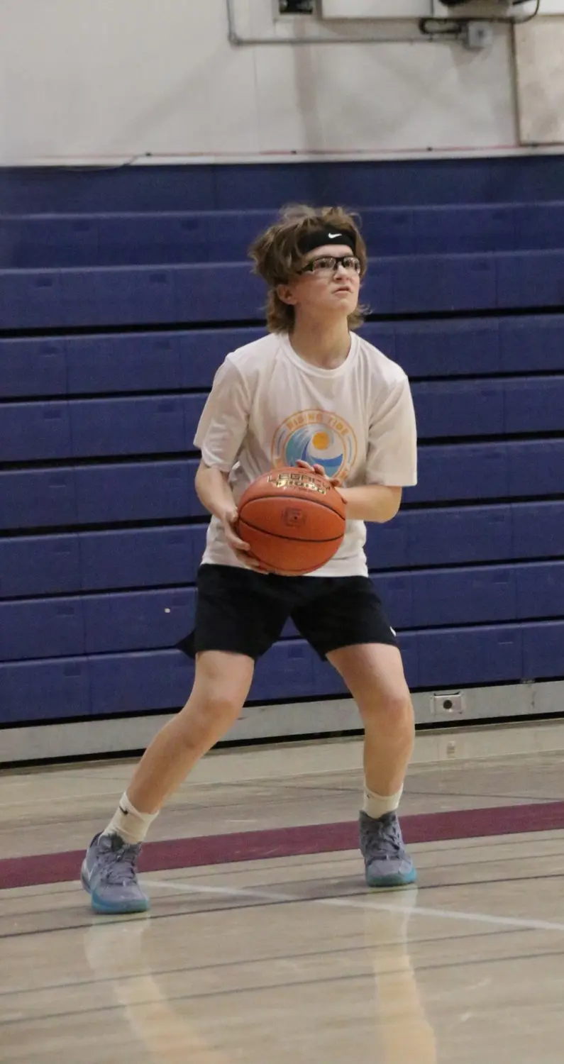 Rising Tide athlete preparing to shoot